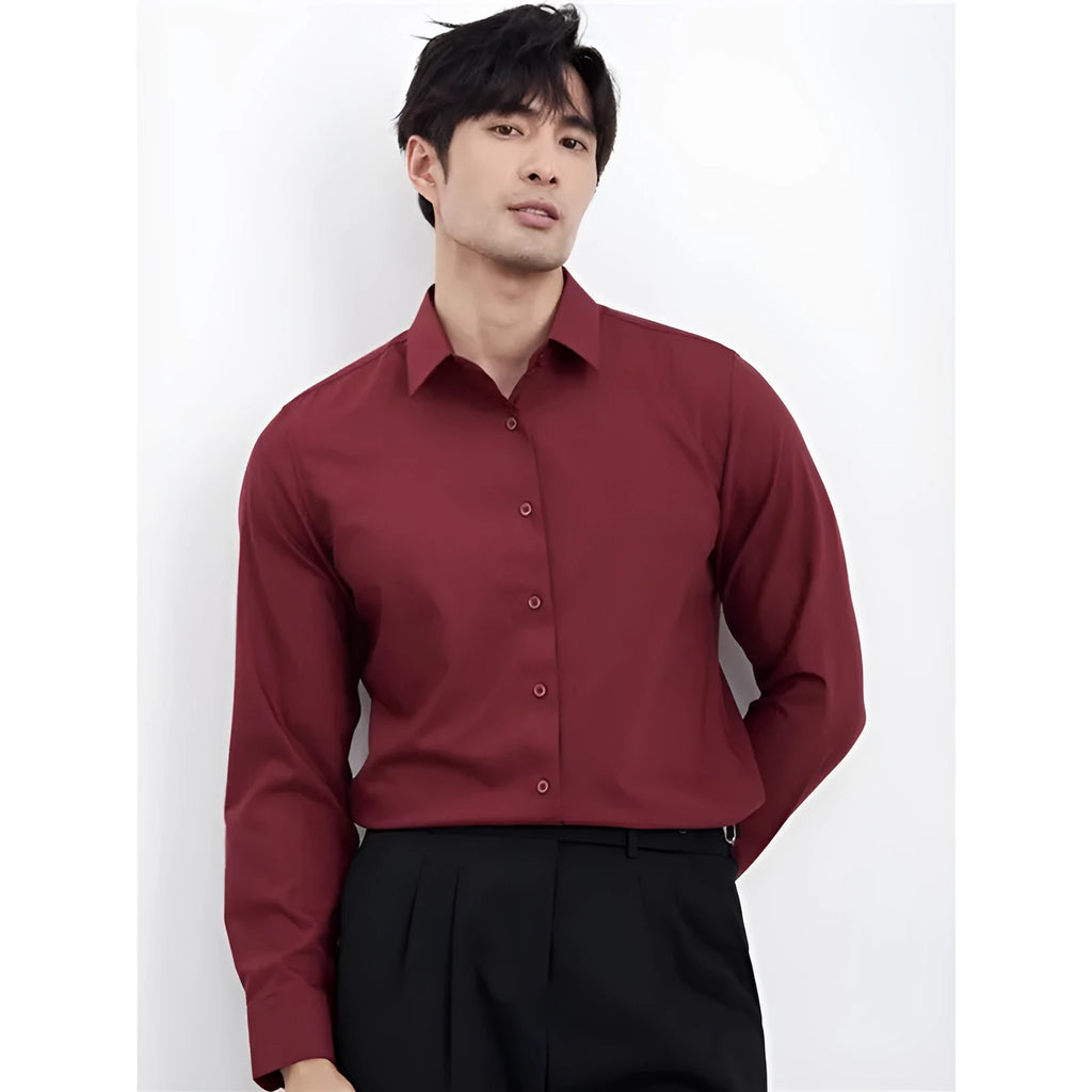 Man wearing a wine red slim fit long sleeve casual business shirt.