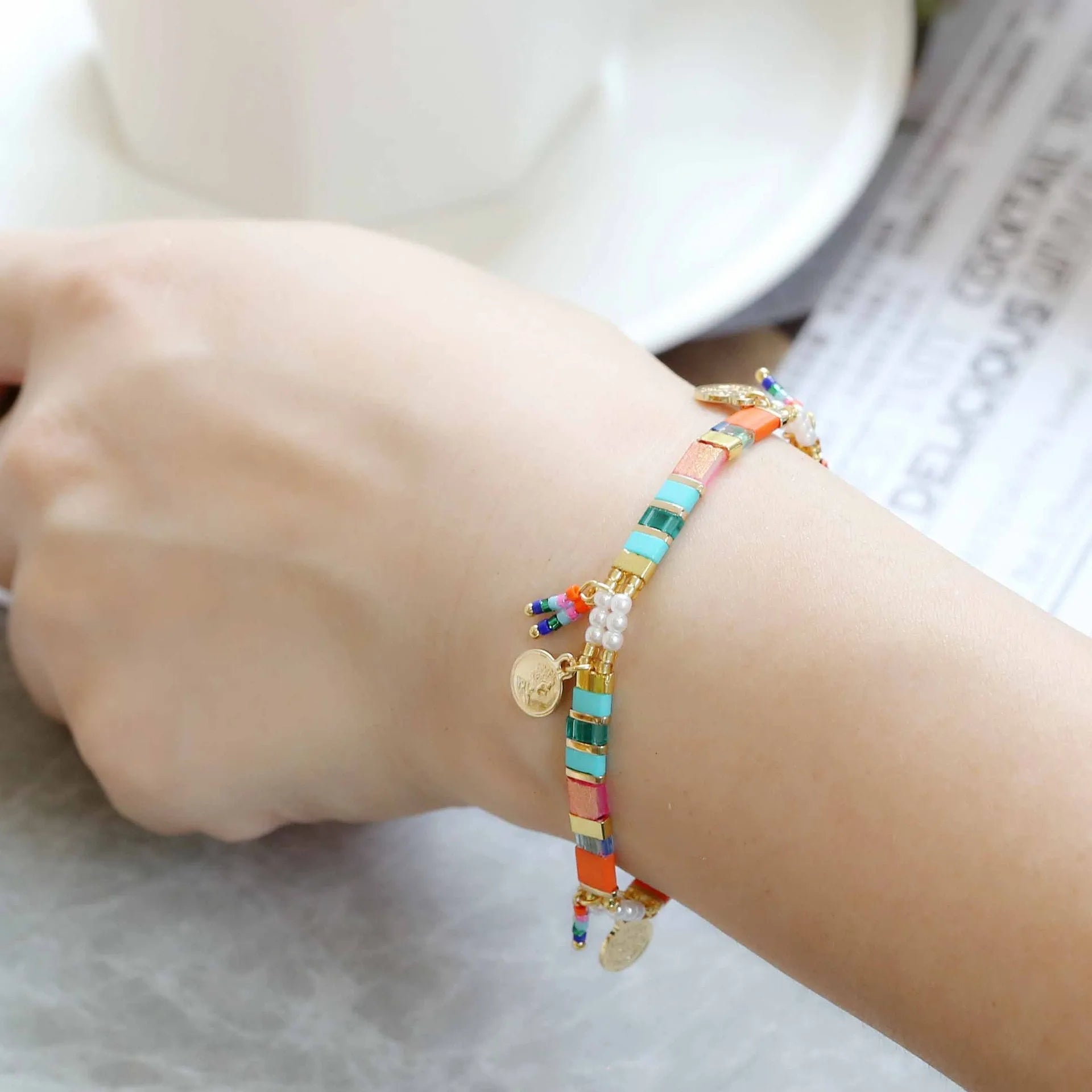 Women's handmade bracelet with imitation pearls and coloured glass beads in original design