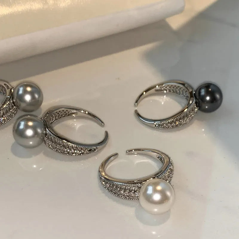 Geometric copper ring with black pearl and adjustable opening for women.