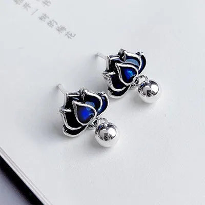 Blue lotus earrings with retro seedpod tassel design and flower shape measuring 1.2cm wide