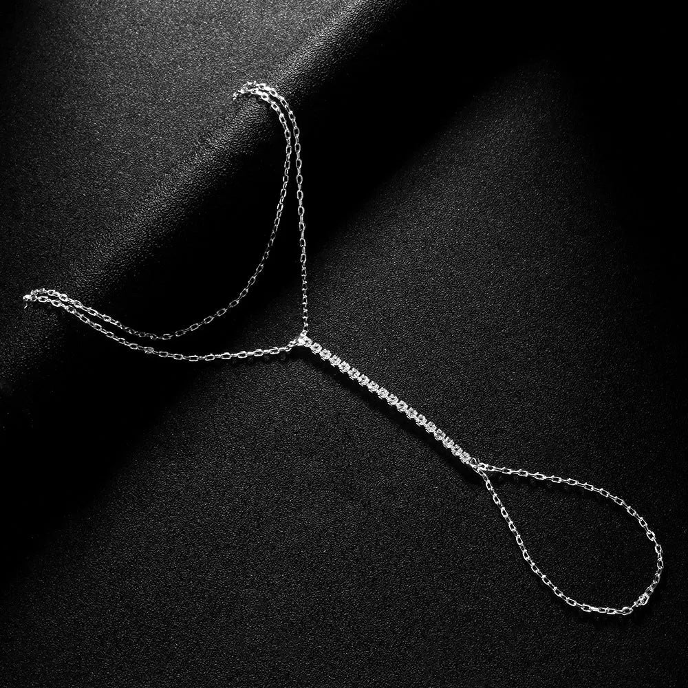 Geometric women's bracelet with rhinestones on alloy band in silver colour.