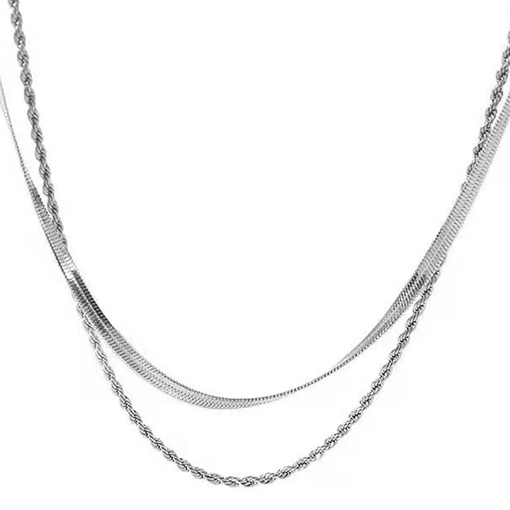 Retro double-layer twist necklace with geometric pendant on a silver snake bone chain.