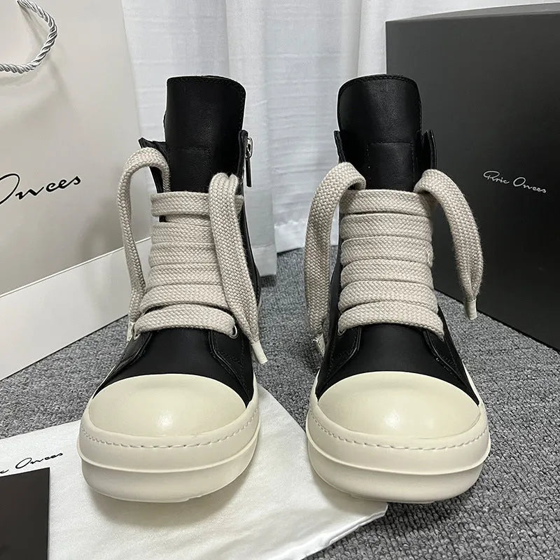 High-top leather sneakers with side zipper in black, white, and red colour options