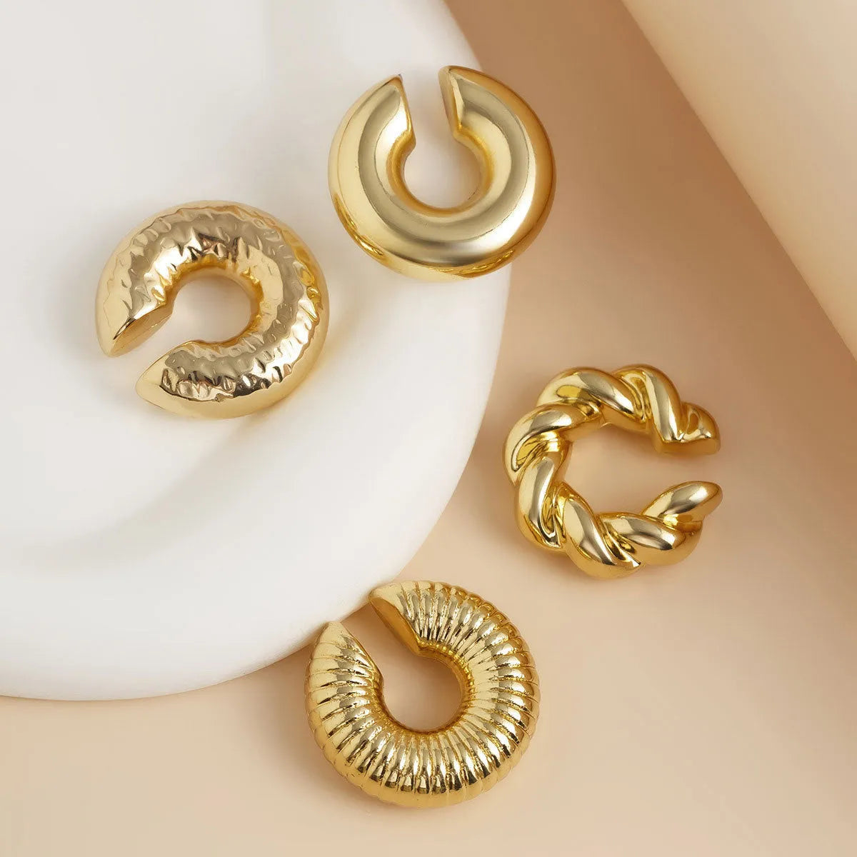 Geometric clip-on earrings for women in gold and silver colours, four-piece set