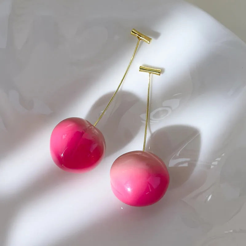 Handmade acrylic peach fruit earrings showing small and large size options with copper findings