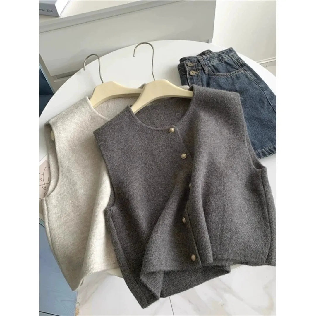A thin, half-sleeve polyester pullover top shown in a choice of smoky grey, greige, apricot, golden camel, black, or Angora red.