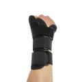 Black carbon fibre wrist guard with grey edging and a thumb strap, shown on a hand.