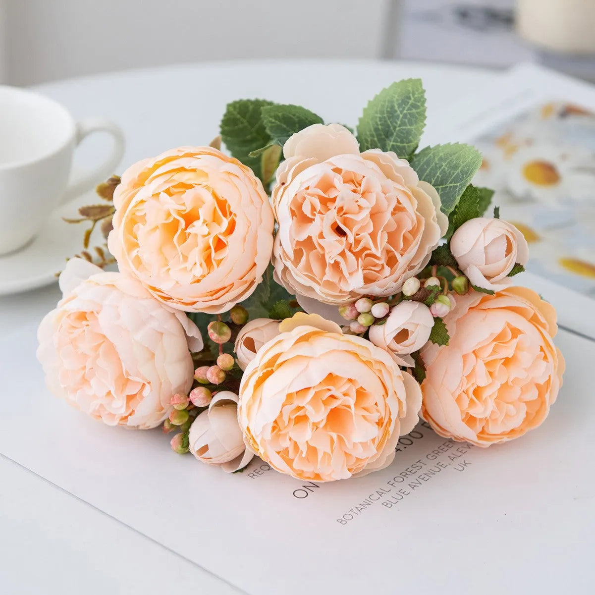 Silk artificial peony bouquet in champagne colour for wedding or home decoration.