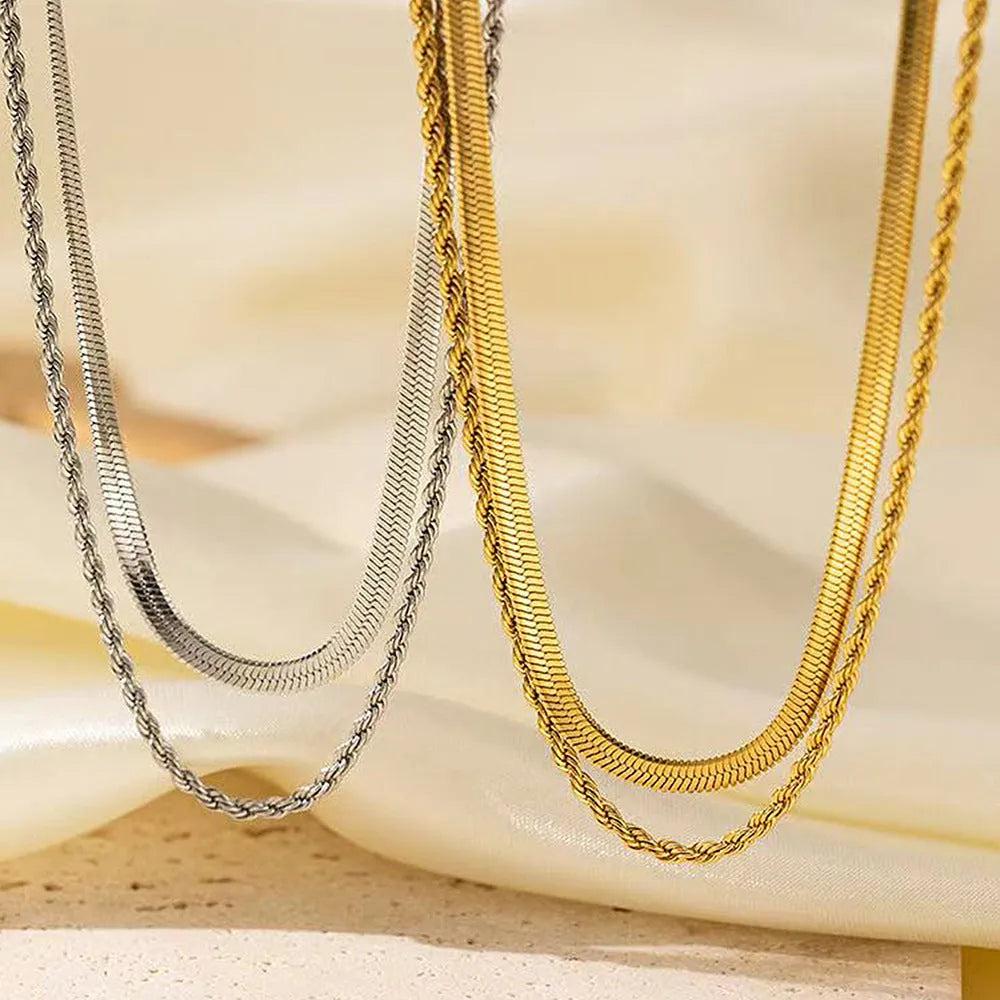 Retro double-layer twist necklace with geometric pendant on a silver snake bone chain.