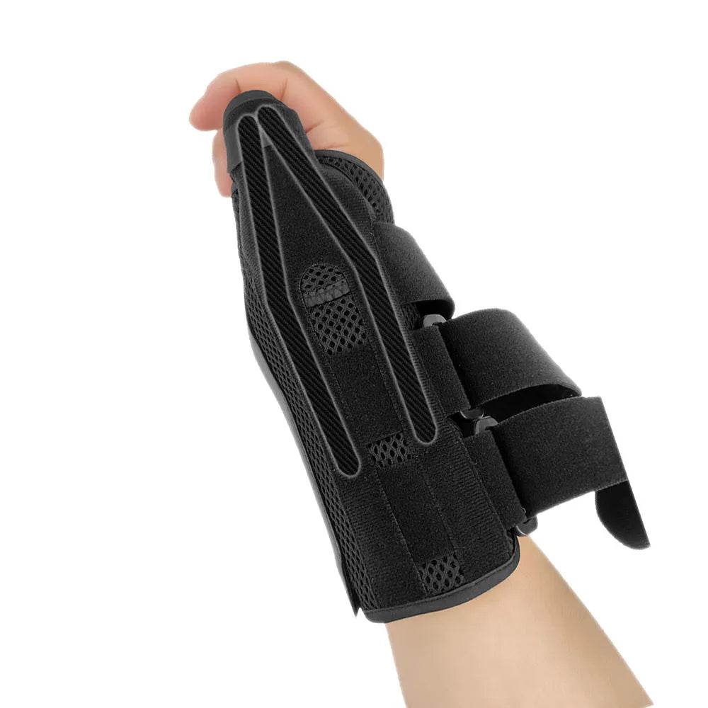Black carbon fibre wrist guard with grey edging and a thumb strap, shown on a hand.