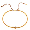 Handmade women's beaded bracelet with colourful glass and glaze beads in geometric bohemian style