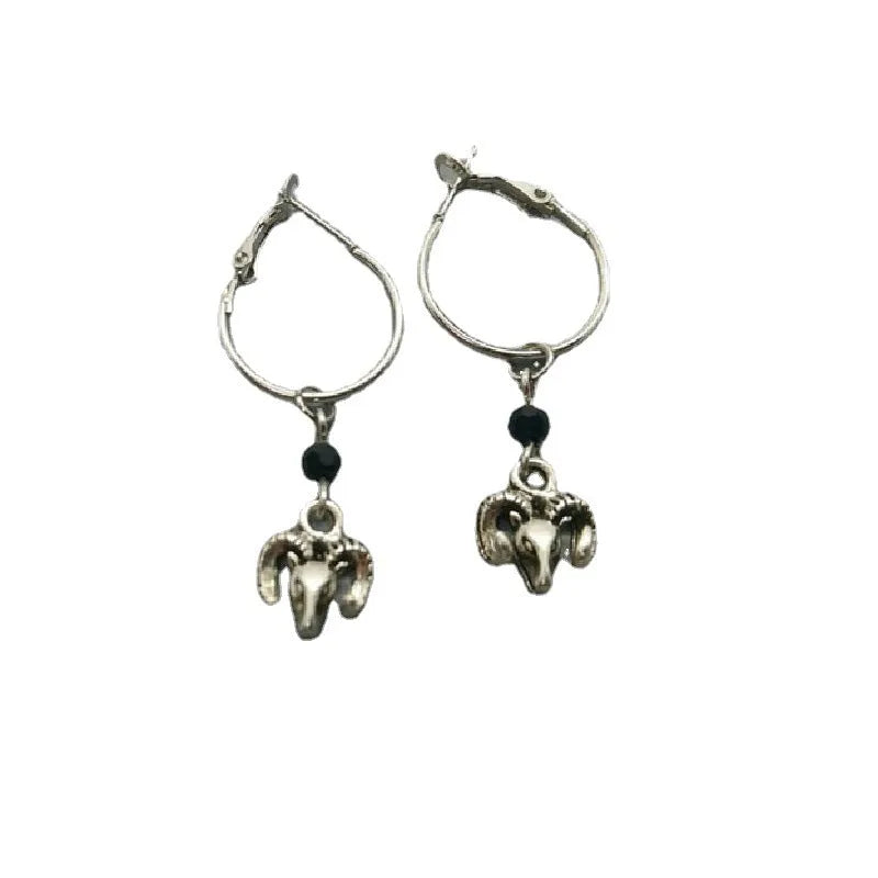 A pair of silver-coloured alloy round ring earrings for women featuring a Tibetan antelope design.