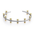 Stainless steel C-shaped bracelet with textured rivet bean beads in gold or steel colour.