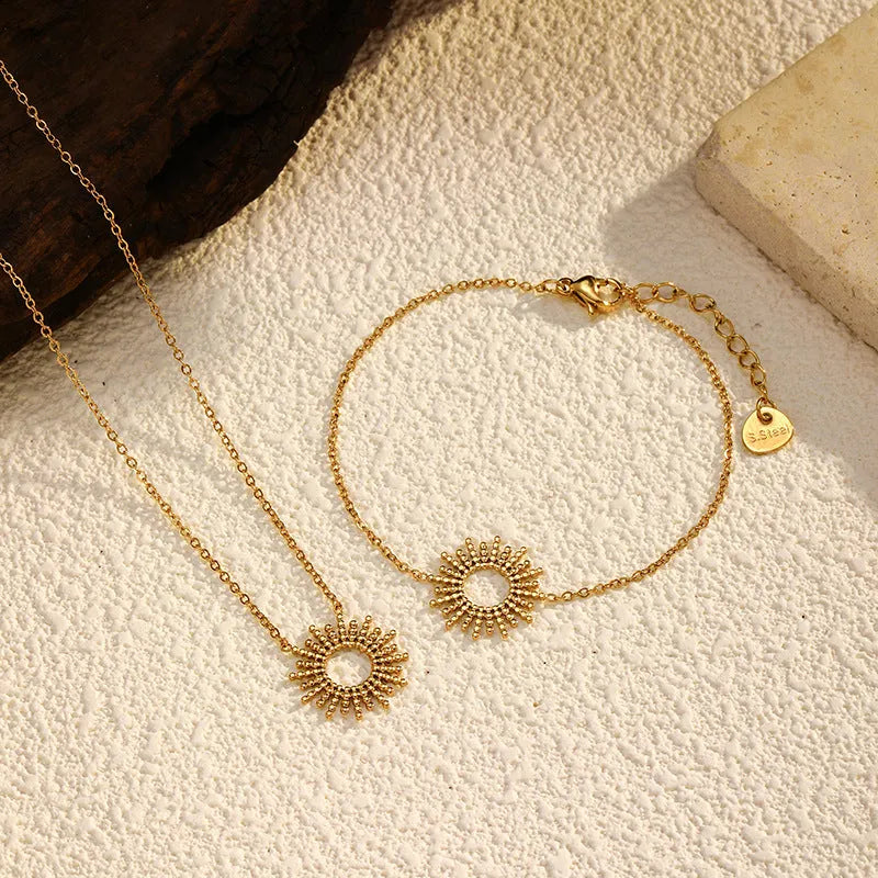 Sunflower yellow gold jewellery set with geometric chain necklace and bracelet