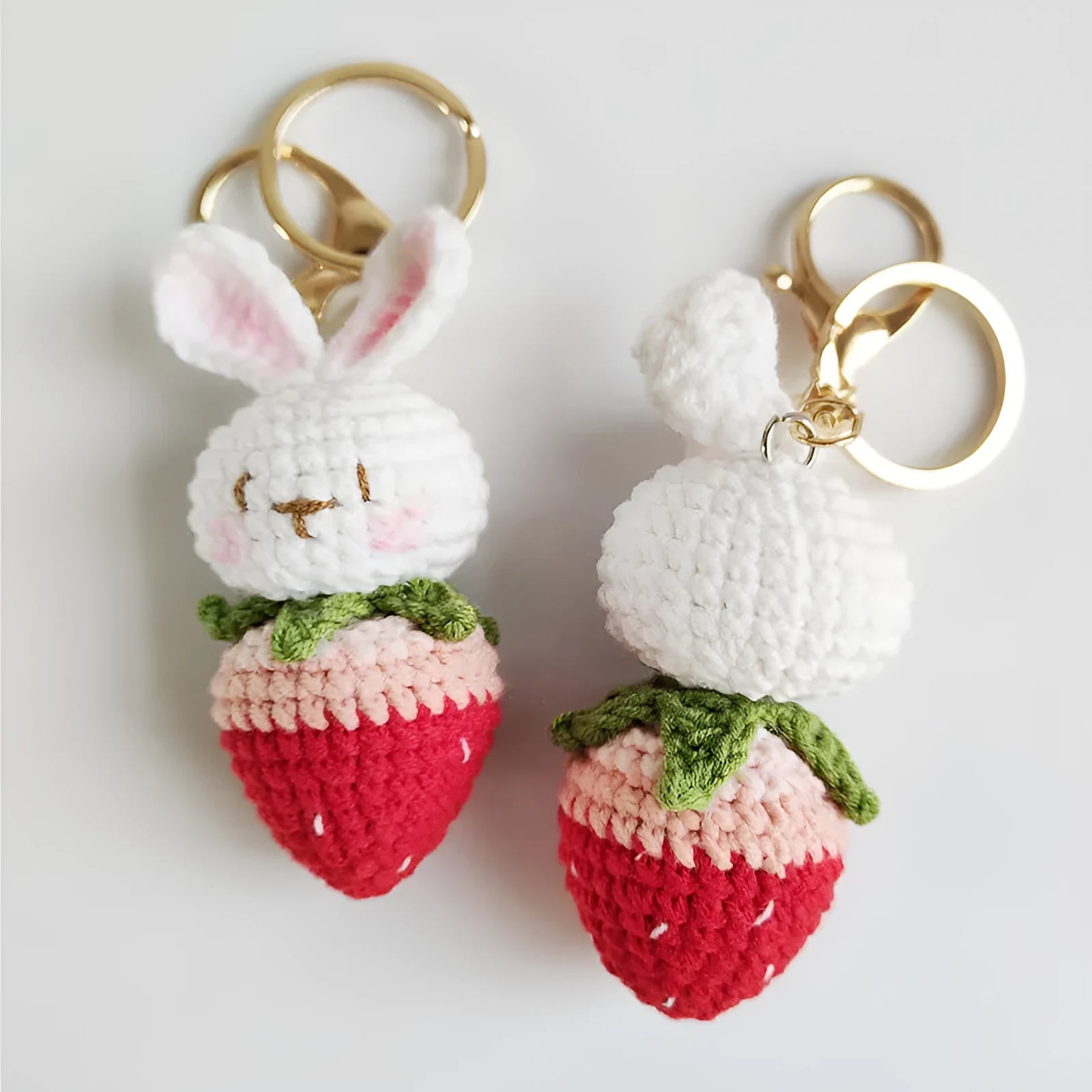 Hand-woven colourful doll wire pendant shaped as a rabbit with a strawberry design, featuring a key loop.