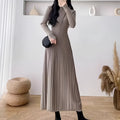 Women's high-waist A-line midi knit skirt in a wool-blend fabric, shown in a solid colour.