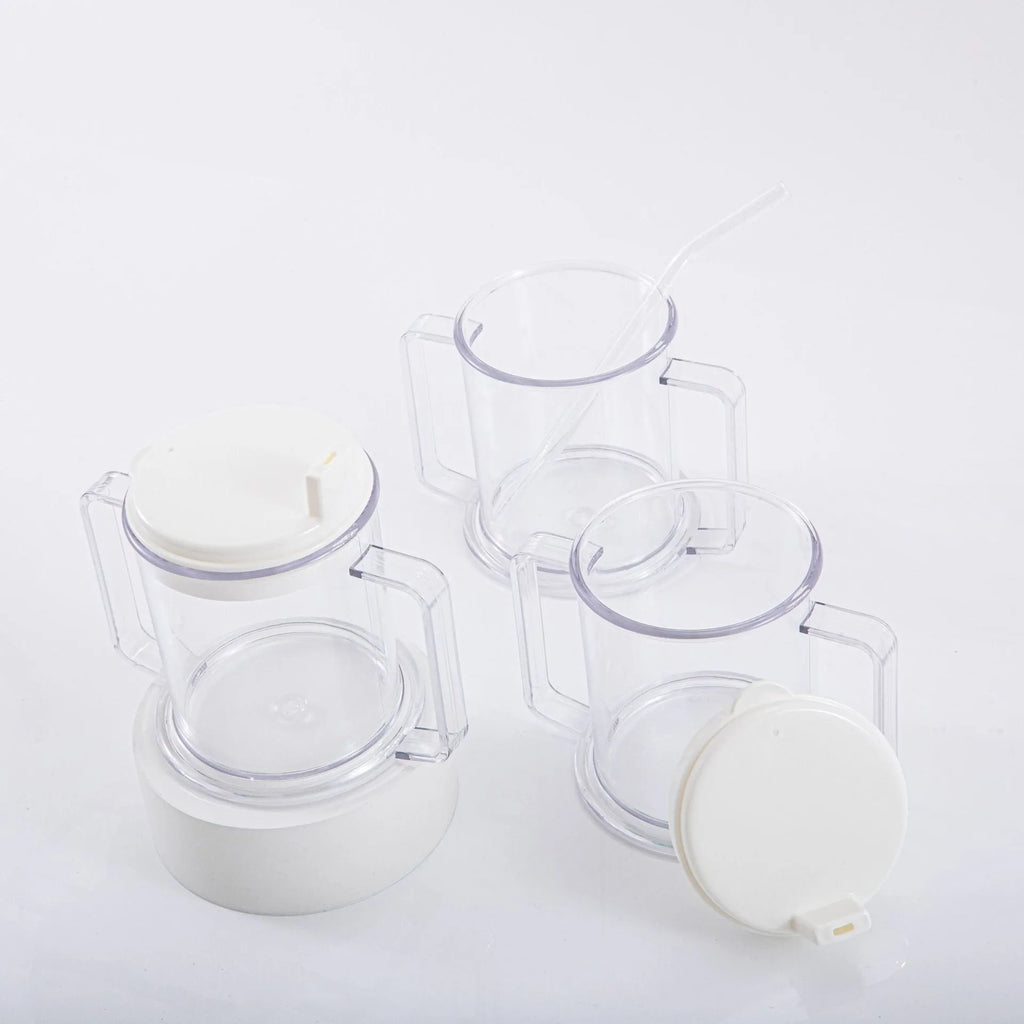 Transparent plastic drinking cup with a lid on a solid background.