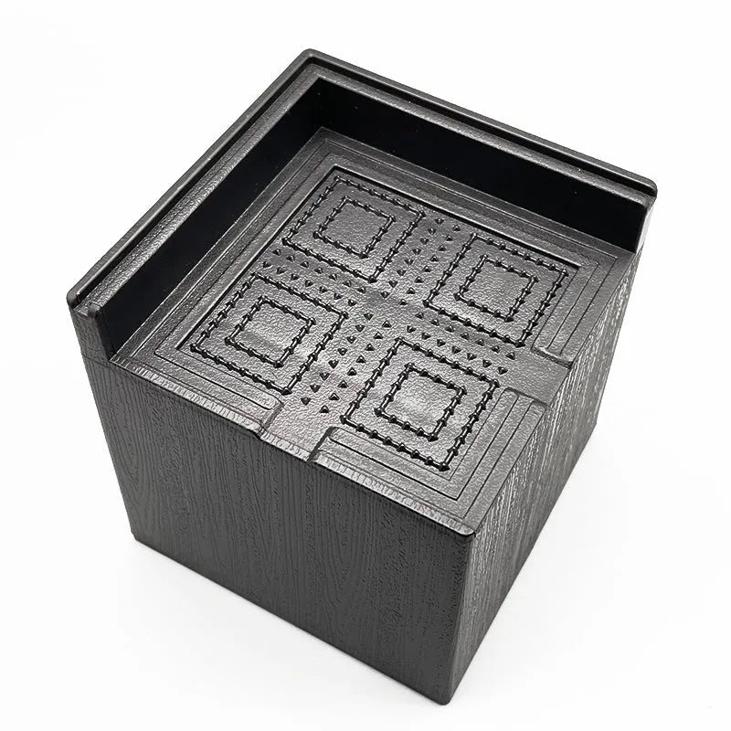 Four black plastic bed foot riser mats for furniture height increasing