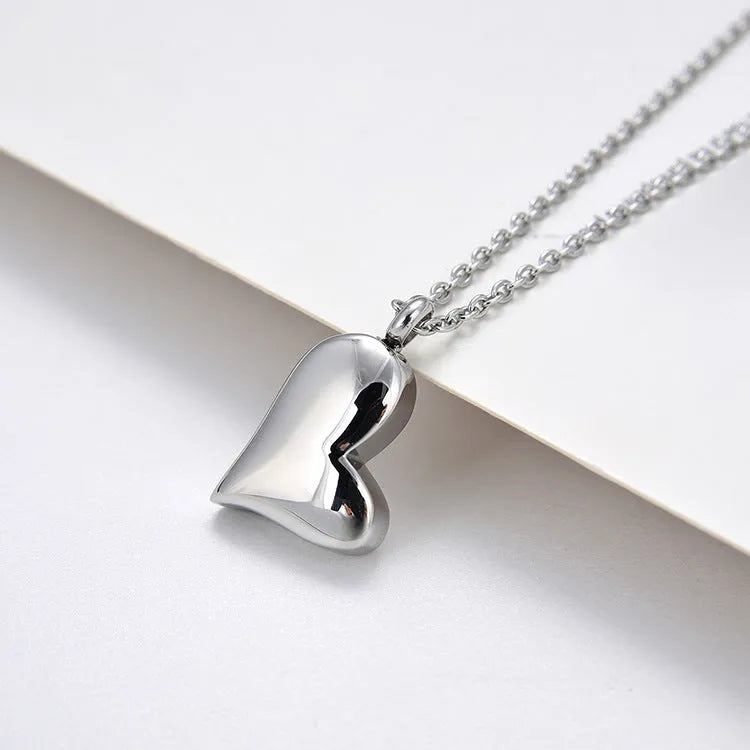Silver curved peach heart stainless steel pendant necklace with adjustable chain length