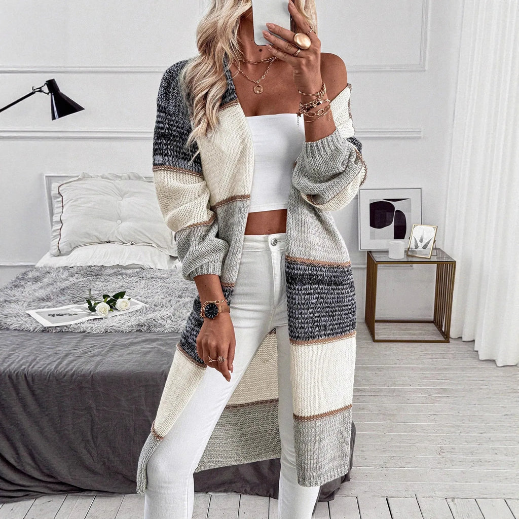 Grey loose fit women's knitted cardigan with long sleeves on hanger