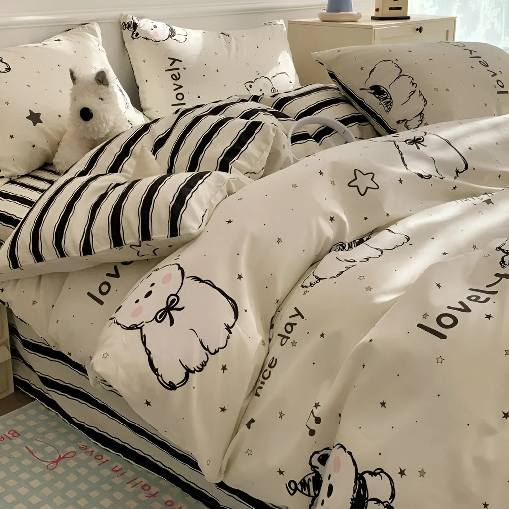 Cartoon dog pattern four-piece pure cotton bedding set laid on a dormitory bed.