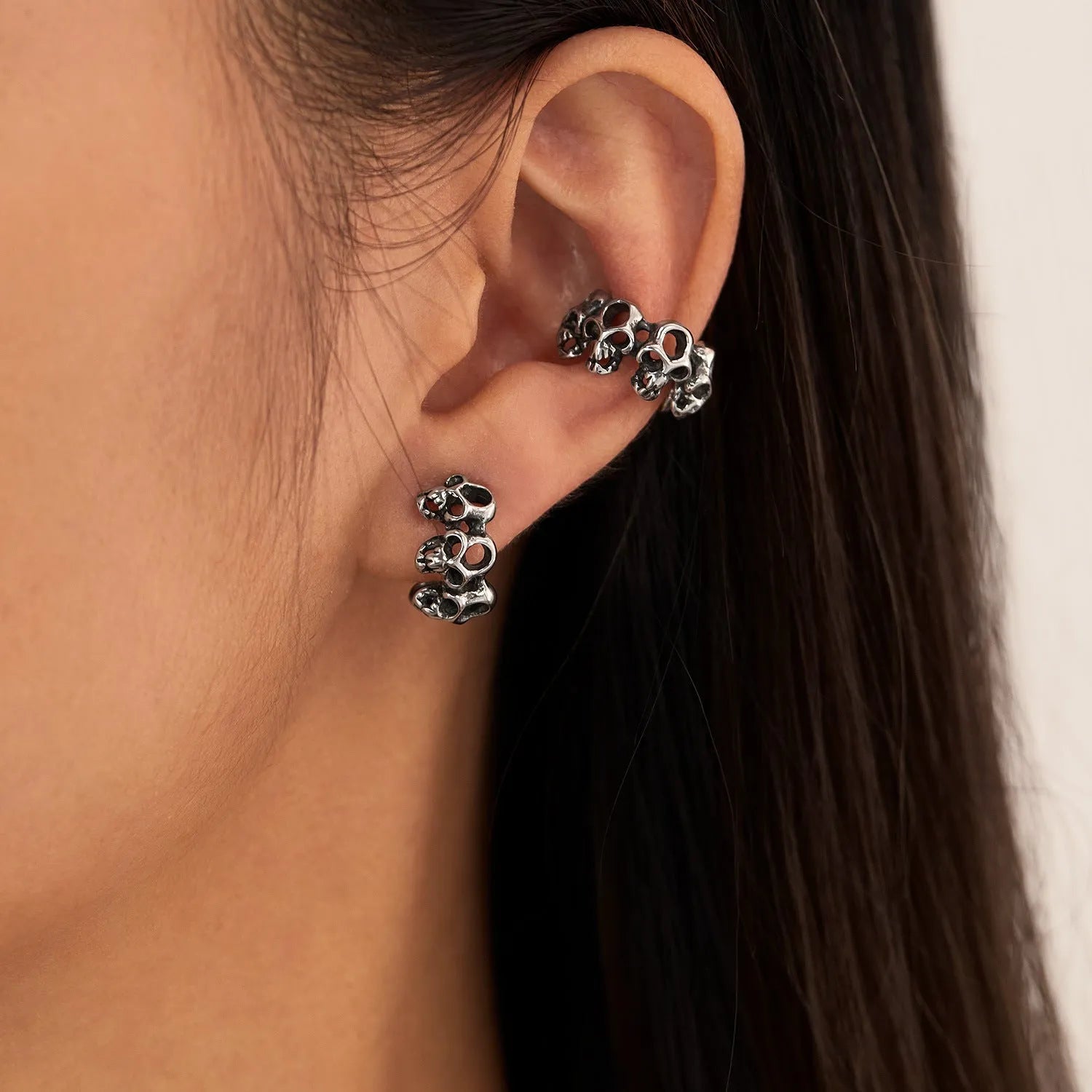 Stainless steel hollow skull ear clip earrings with geometric retro design