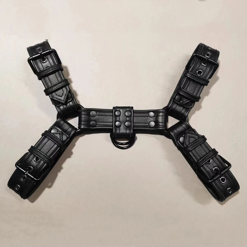 Black leather chest harness with metal buckles and adjustable straps for muscle bondage styling