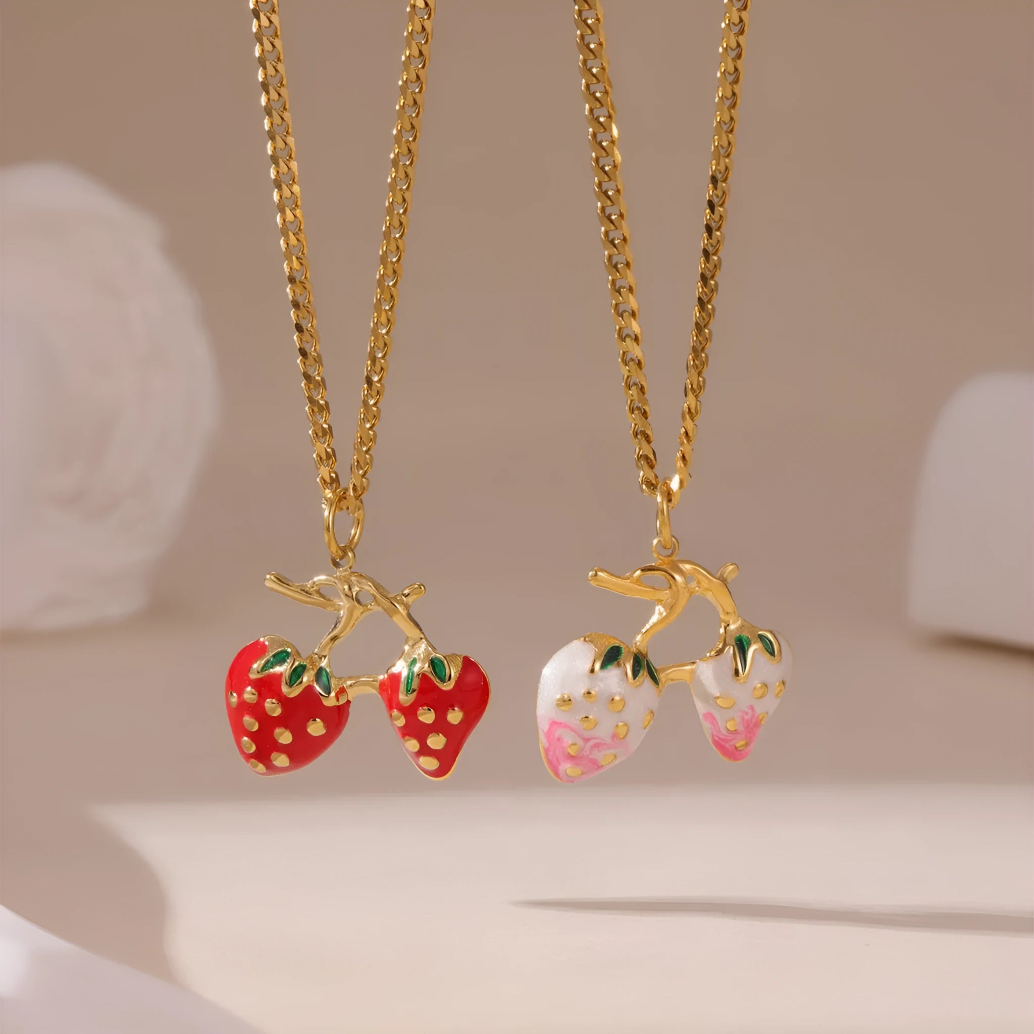 Stainless steel strawberry fruit pendant necklace in red and white gradient colour options.