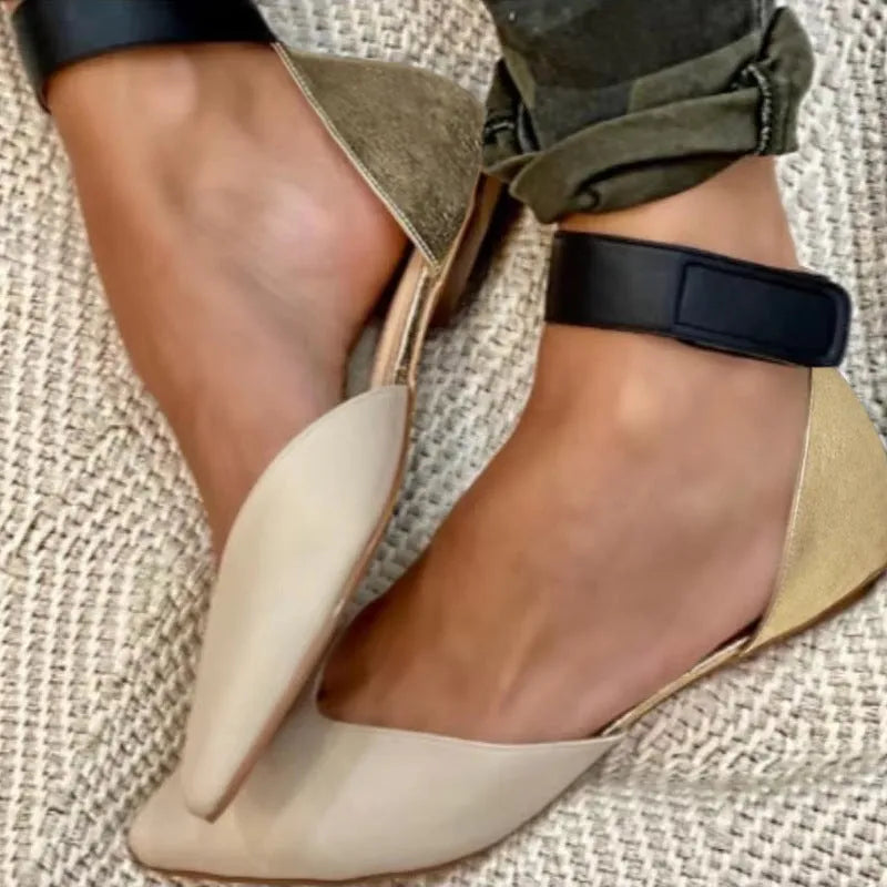 Women's beige velcro hollowed sandals with flat heel on a white background