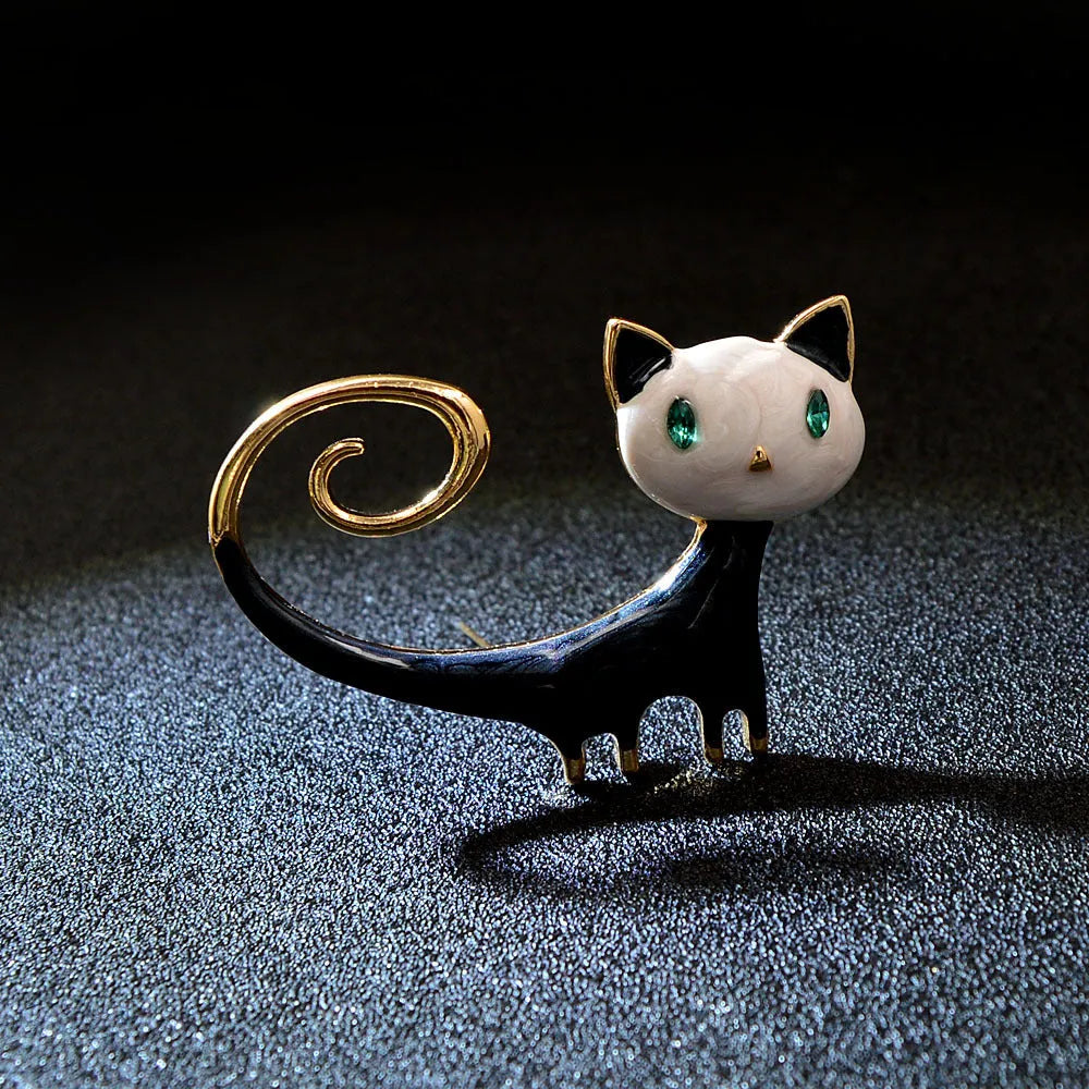 Personalised painted cat tail up brooch in alloy metal, available in white or orange colour options.