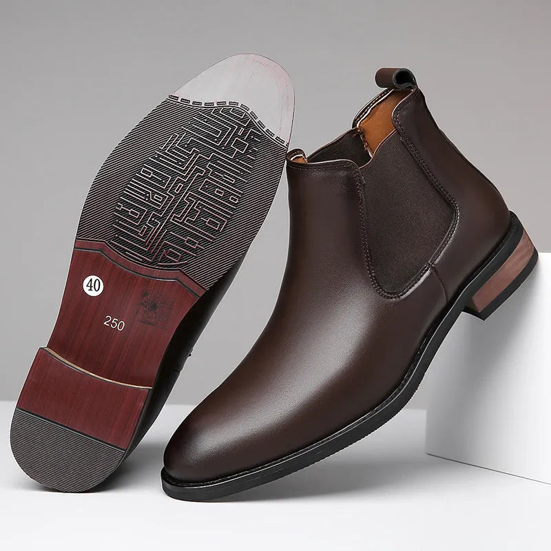 Men's black Chelsea boots with pointed toe design and artificial PU leather construction