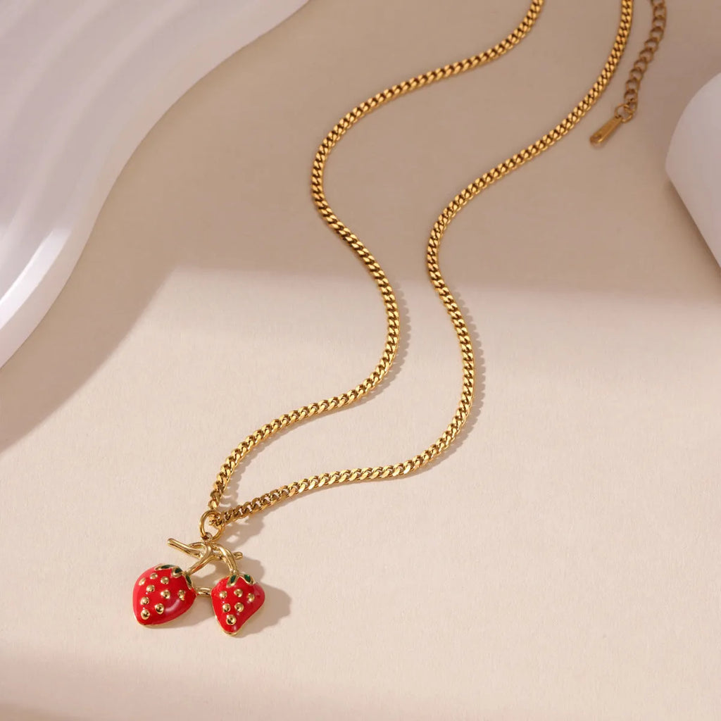 Stainless steel strawberry fruit pendant necklace in red and white gradient colour options.