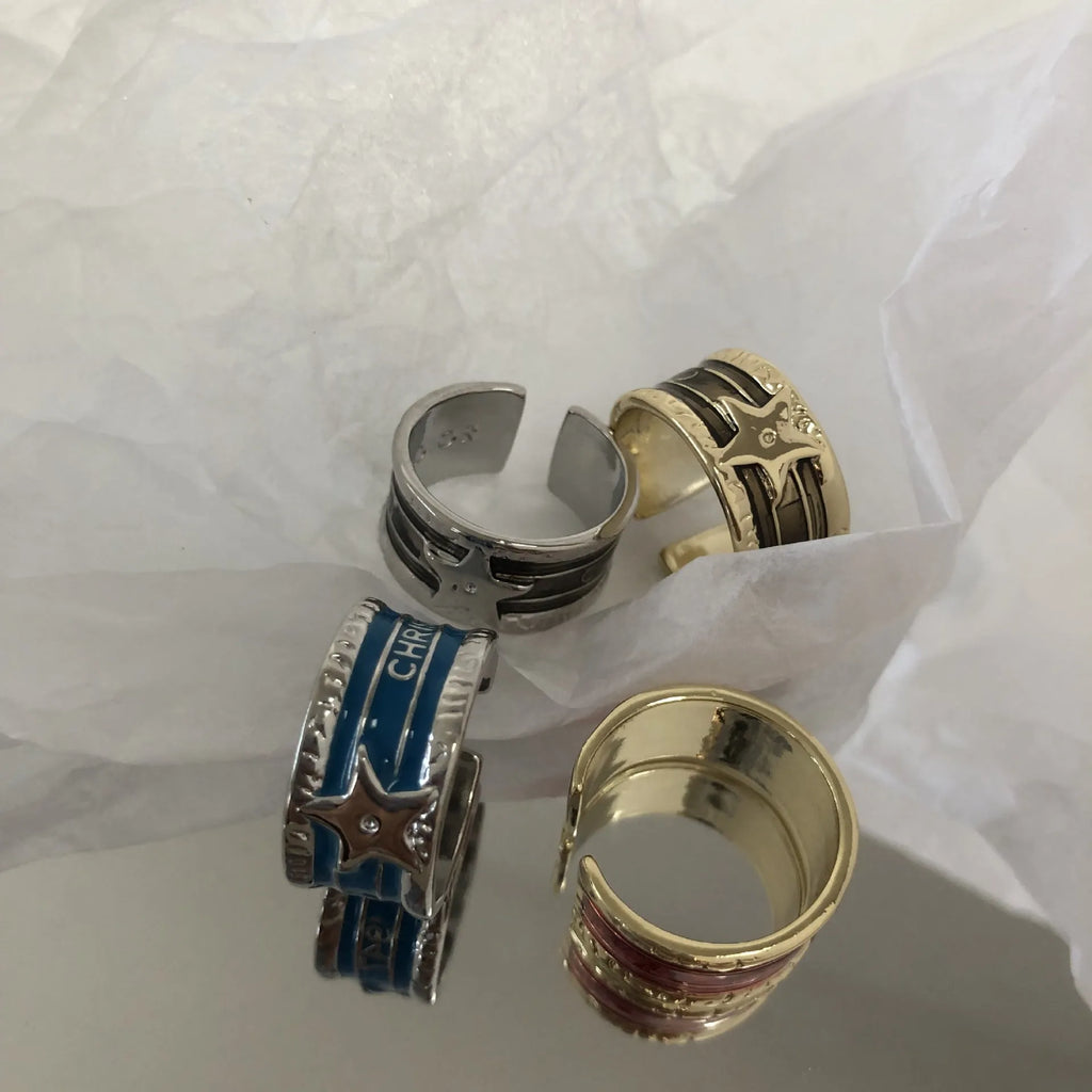 Adjustable copper geometry ring with distressed XINGX drop oil design in choice of colours.
