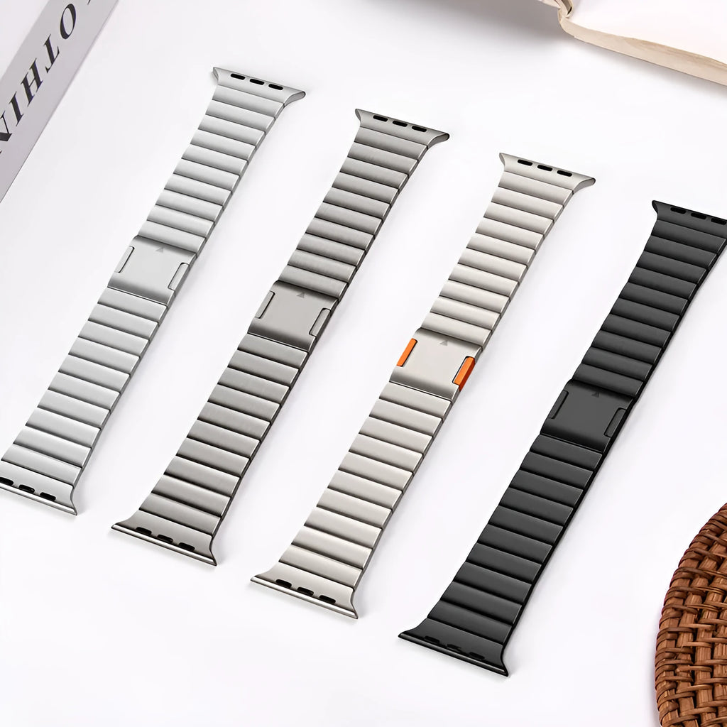 Stainless steel magnetic buckle watch strap for Apple Watch in silver colour on grey background