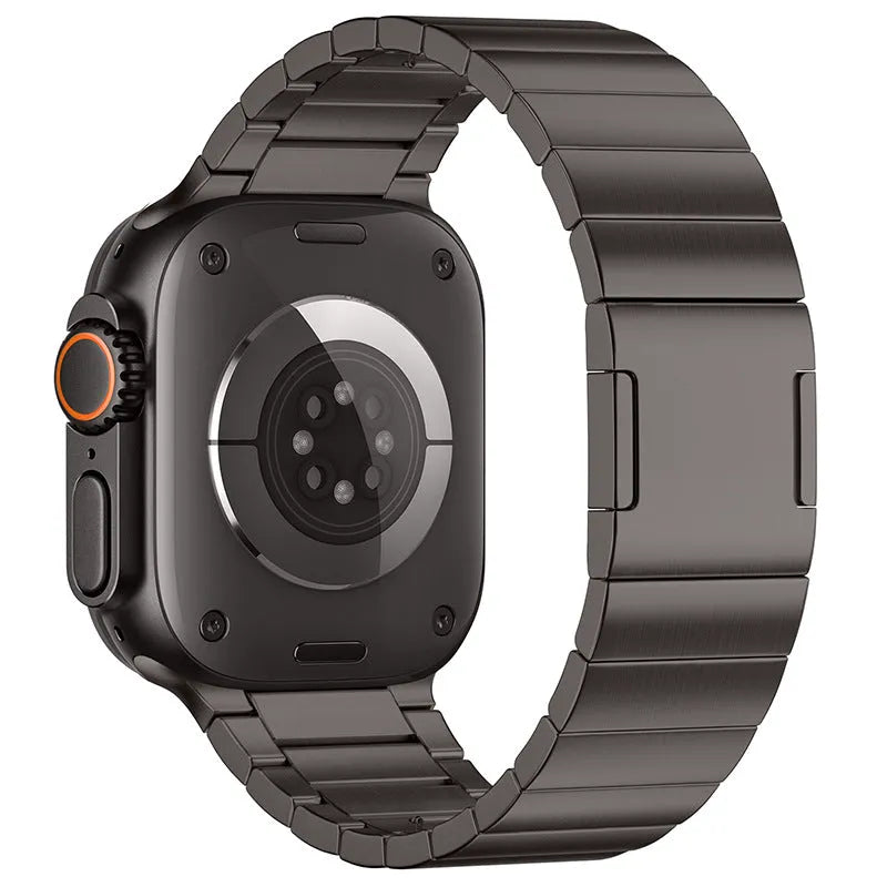 Stainless steel magnetic buckle watch strap for Apple Watch in silver colour on grey background