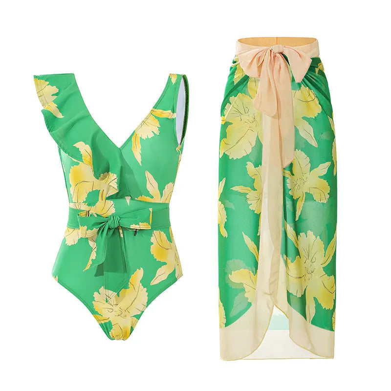 Solid colour women's one-piece swimsuit with spaghetti straps and a matching detachable skirt.