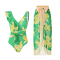 Solid colour women's one-piece swimsuit with spaghetti straps and a matching detachable skirt.