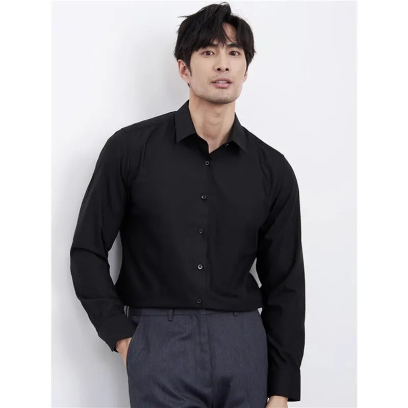 Man wearing a wine red slim fit long sleeve casual business shirt.