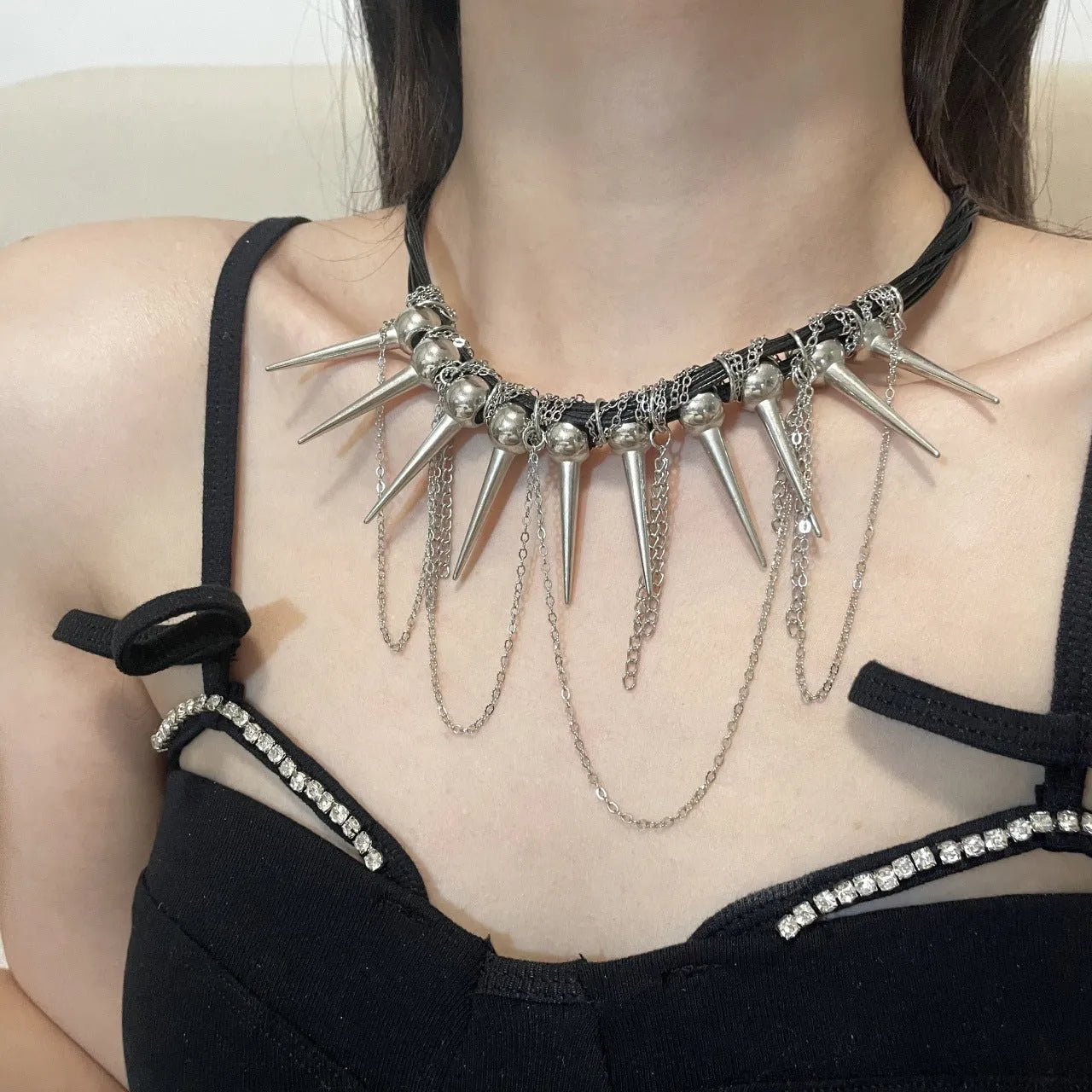 Women's leather necklace with electroplated rivets and a winding beaded tassel pendant