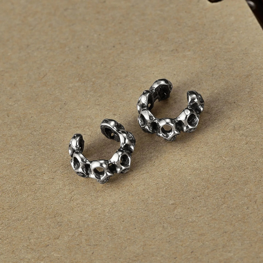 Stainless steel hollow skull ear clip earrings with geometric retro design