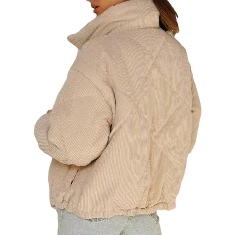 Women's apricot coloured corduroy jacket with a stand collar and front zipper on a hanger.