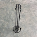 Wrought iron coffee capsule storage rack holding pods, in spray black finish.