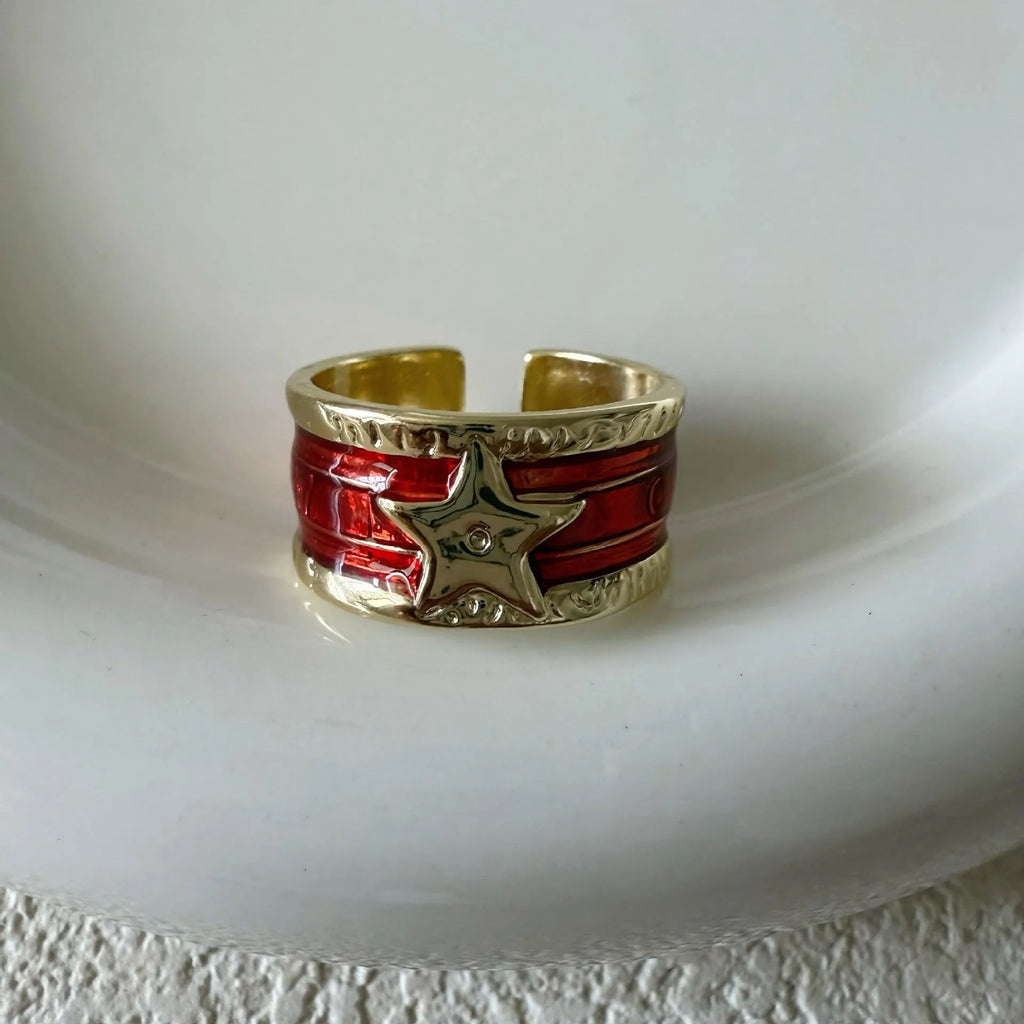Adjustable copper geometry ring with distressed XINGX drop oil design in choice of colours.