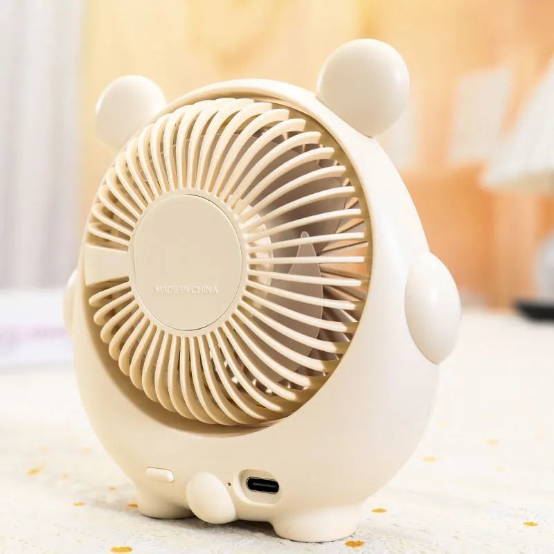 Dog-shaped desktop USB fan showing colour options including brown bear and pink puppy variants
