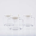 Transparent plastic drinking cup with a lid on a solid background.