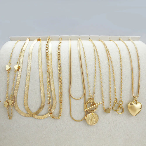 10 piece gold electroplated women's necklace set with adjustable chain length on display