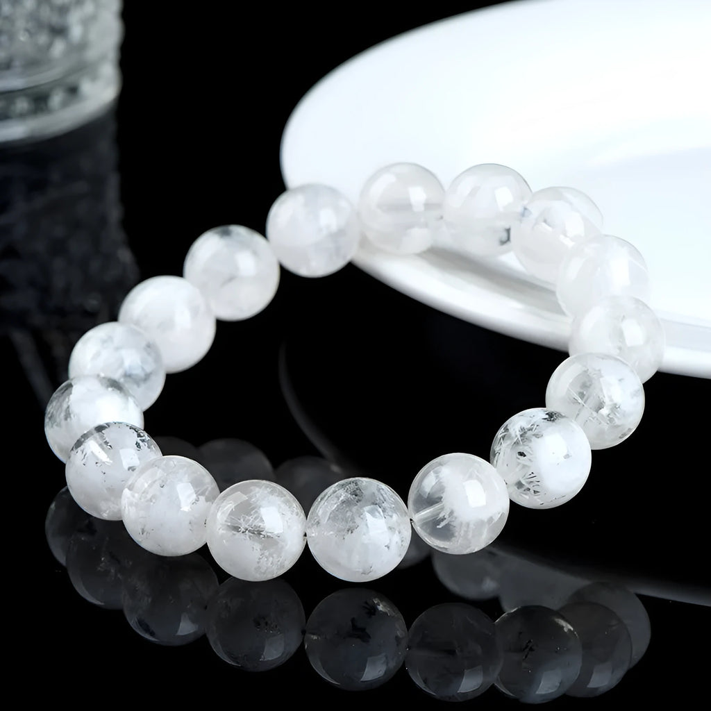 Women's crystal bracelet with natural blizzard snowflake round beads and traditional charm elements