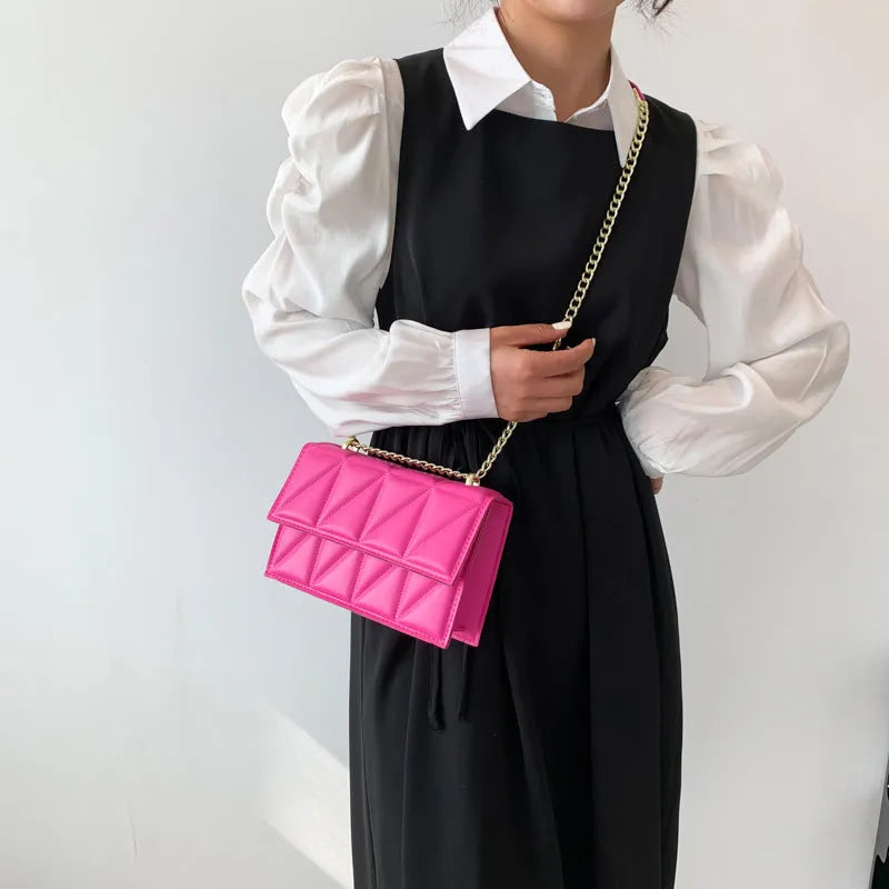Small square PU chain crossbody bag in horizontal shape with spliced detail, available in five colours.