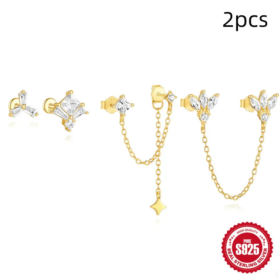 A pair of golden S925 sterling silver stud earrings with zircon inlay, designed for double ear piercings.