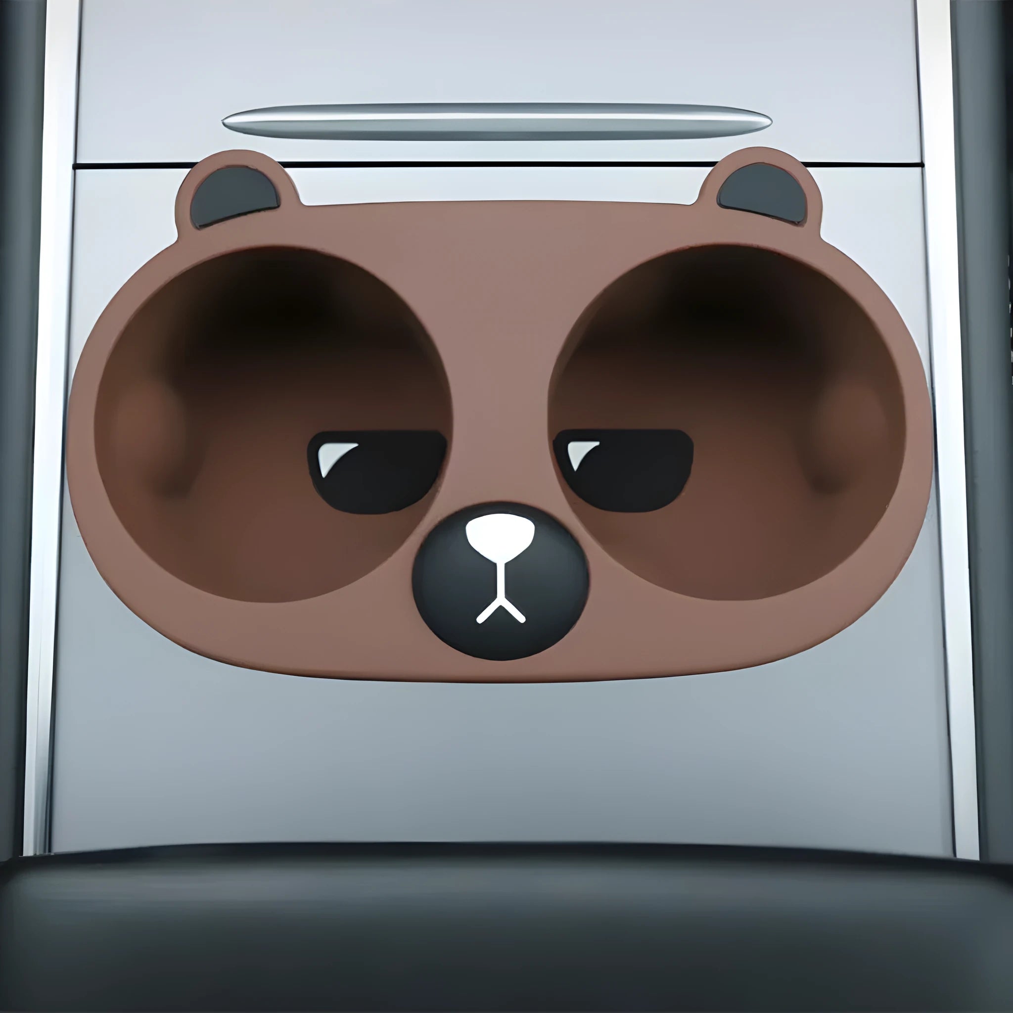 Silicone car cup holder insert in grey colour with cartoon design for reducing drink movement